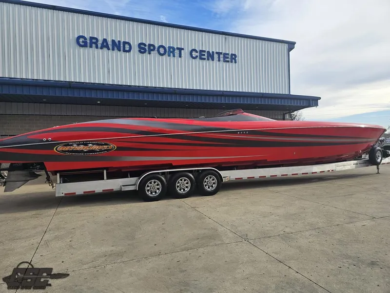 Slide: The Image of 2010 Outerlimits 52 SL powerboat on trailer at Grand Sport Center. - 16