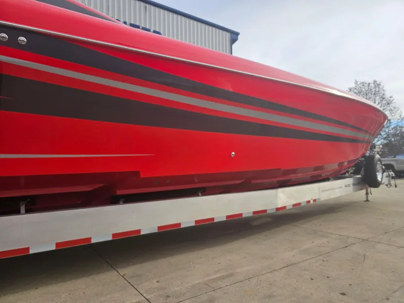 Slide: The Image of Red 2010 Outerlimits 52 SL speedboat on trailer, side view. - 18