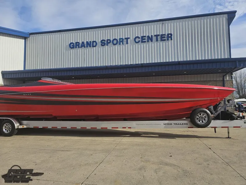 Slide: The Image of Red 2010 Outerlimits 52 SL boat on trailer at Grand Sport Center. - 19