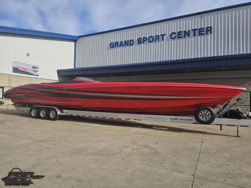 Slide: The Image of Red 2010 Outerlimits 52 SL speedboat on trailer at Grand Sport Center. - 20