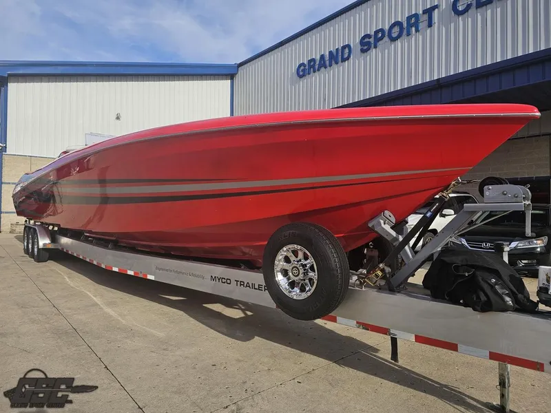 Slide: The Image of Red 2010 Outerlimits 52 SL boat on trailer at Grand Sport Center. - 21