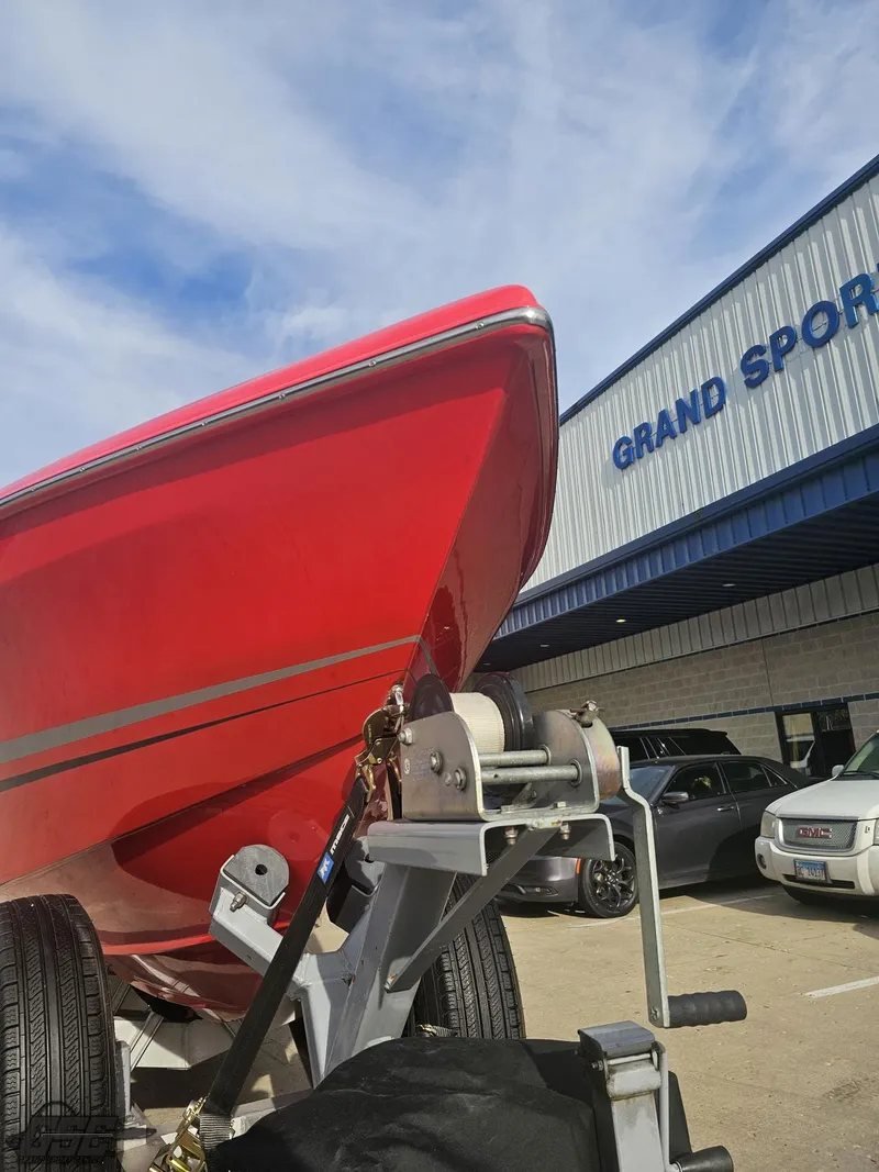 Slide: The Image of 2010 Outerlimits 52 SL boat on trailer at Grand Sport dealership. - 22