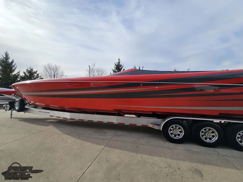 Slide: The Image of 2010 Outerlimits 52 SL powerboat in red and black on a trailer. - 27