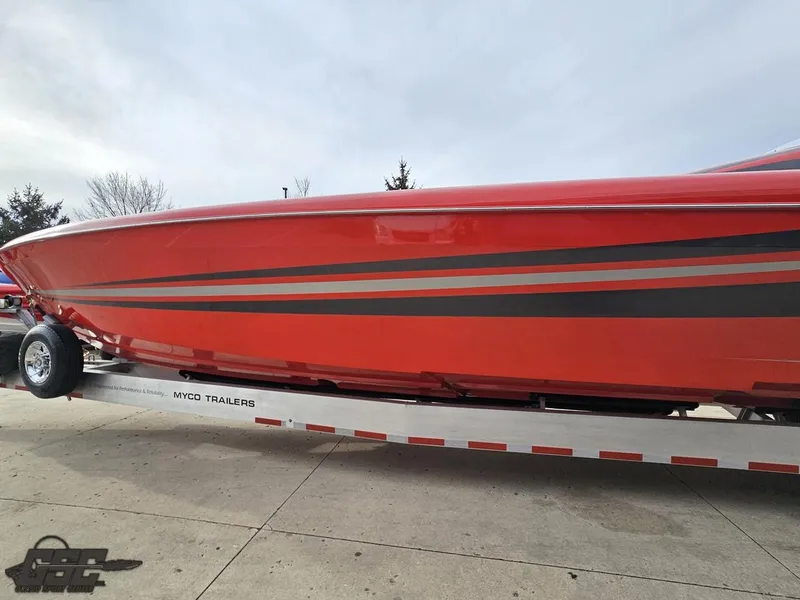 Slide: The Image of Red 2010 Outerlimits 52 SL boat on trailer, side view. - 28