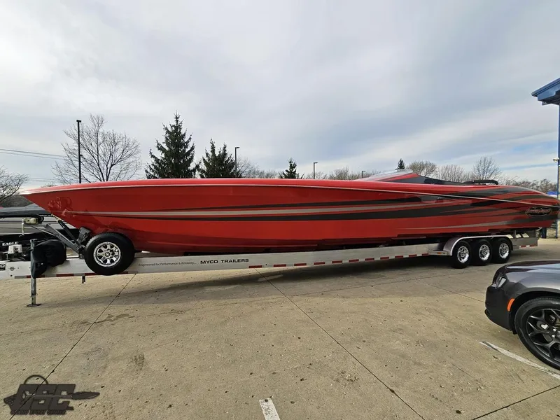 Slide: The Image of 2010 Outerlimits 52 SL powerboat on trailer, red and black design. - 30