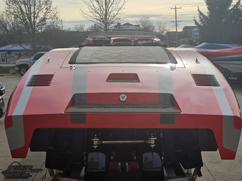 Slide: The Image of Red 2010 Outerlimits 52 SL boat with white stripes, rear view. - 39