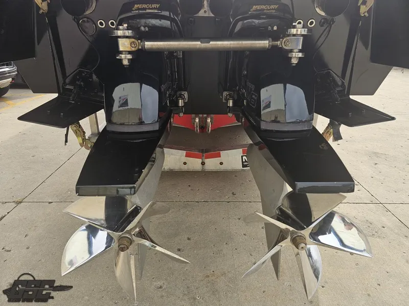 Slide: The Image of 2010 Outerlimits 52 SL boat with dual Mercury outboard engines and stainless steel propellers. - 44