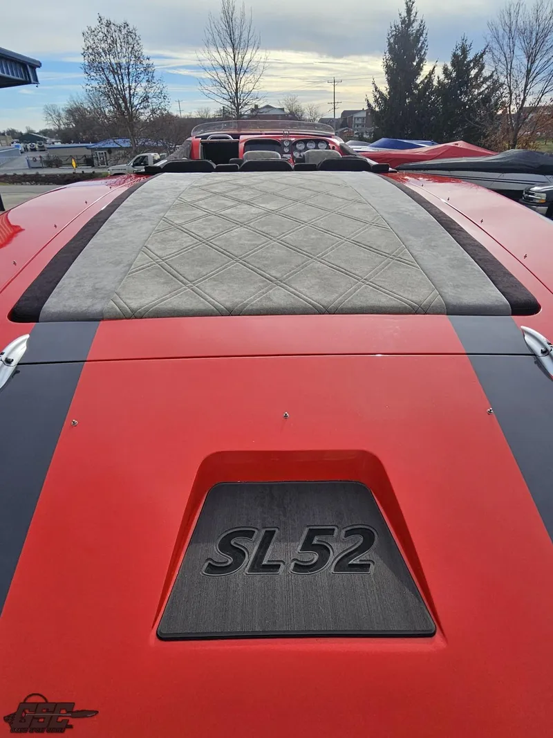 Slide: The Image of 2010 Outerlimits 52 SL boat, red and gray design, rear view. - 47