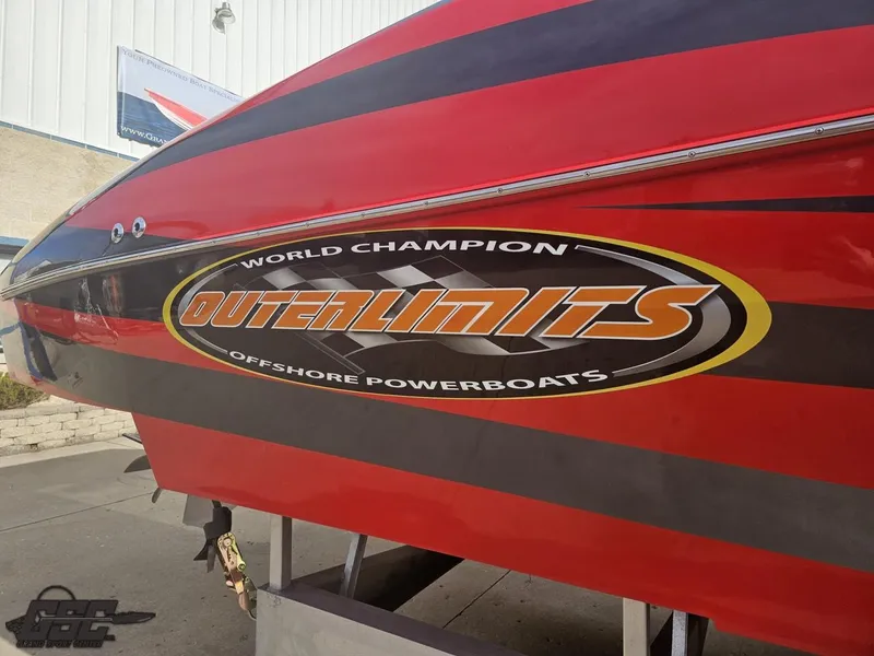 Slide: The Image of 2010 Outerlimits 52 SL powerboat with bold red and black design, showcasing "World Champion" logo. - 8