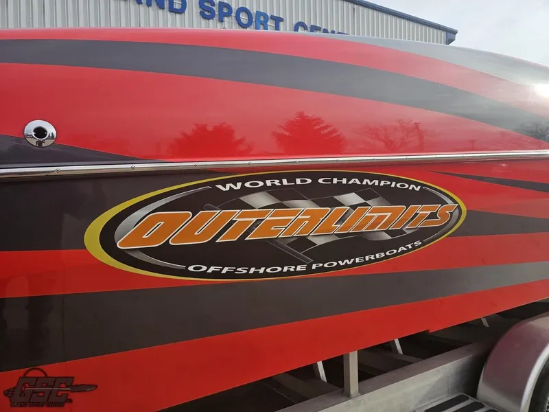 Slide: The Image of Red and black 2010 Outerlimits 52 SL powerboat with logo and "World Champion" text. - 9