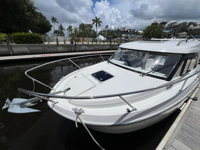 Slide: The Image of 2025 Beneteau Antares 8 docked, showcasing sleek design and modern features. - 12