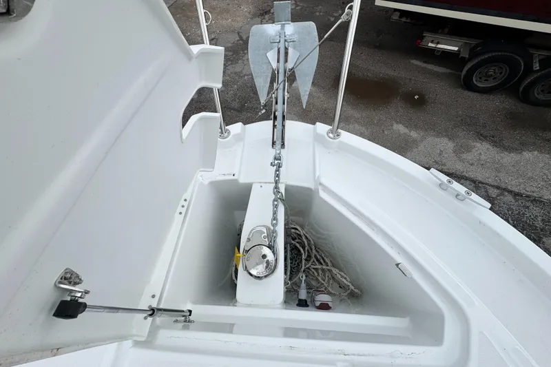Slide: The Image of Anchor compartment of 2025 Beneteau Antares 8 boat, featuring anchor and rope storage. - 13