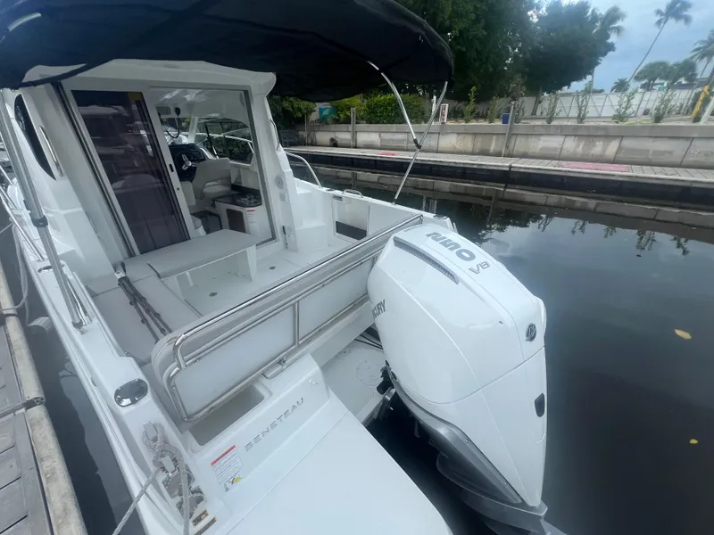Slide: The Image of 2025 Beneteau Antares 8 boat docked, featuring a Mercury V8 engine. - 4