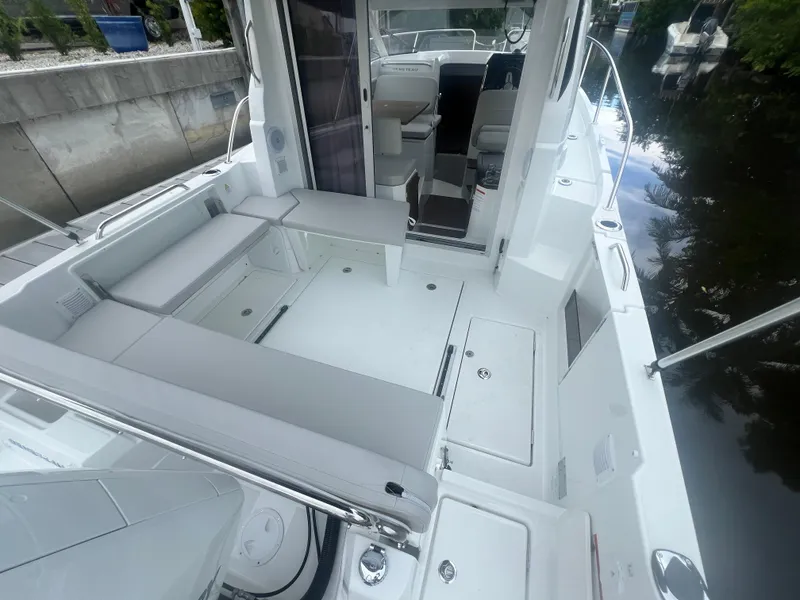 Slide: The Image of 2025 Beneteau Antares 8 boat interior with seating and storage compartments. - 5