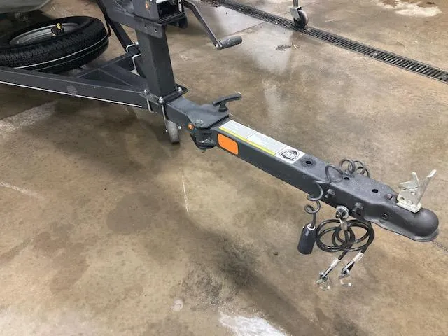 Slide: The Image of 2019 Tracker Pro 170 trailer hitch on wet concrete floor. - 10