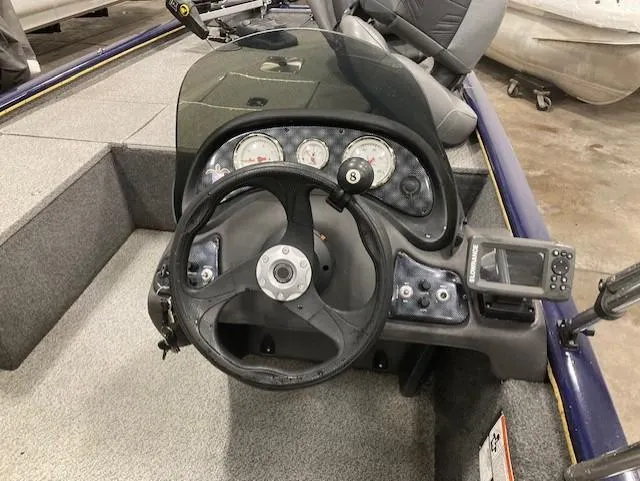 Slide: The Image of 2019 Tracker Pro 170 boat dashboard with steering wheel and gauges. - 4