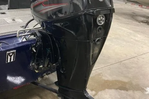 Slide: The Image of 2019 Tracker Pro 170 boat with a Mercury outboard motor in a garage. - 7