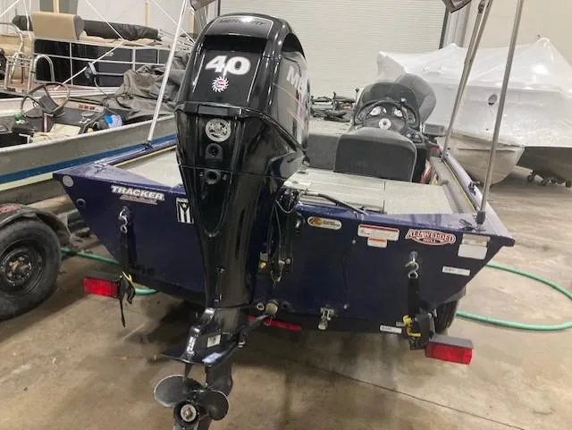 Slide: The Image of 2019 Tracker Pro 170 boat with 40 HP Mercury engine in a garage. - 8