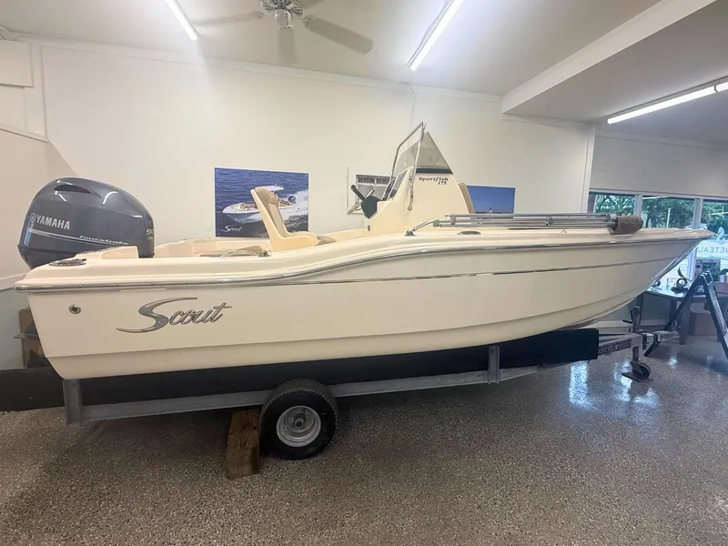 Slide: The Image of 2024 Scout 175 Sportfish boat in showroom with Yamaha engine. - 0