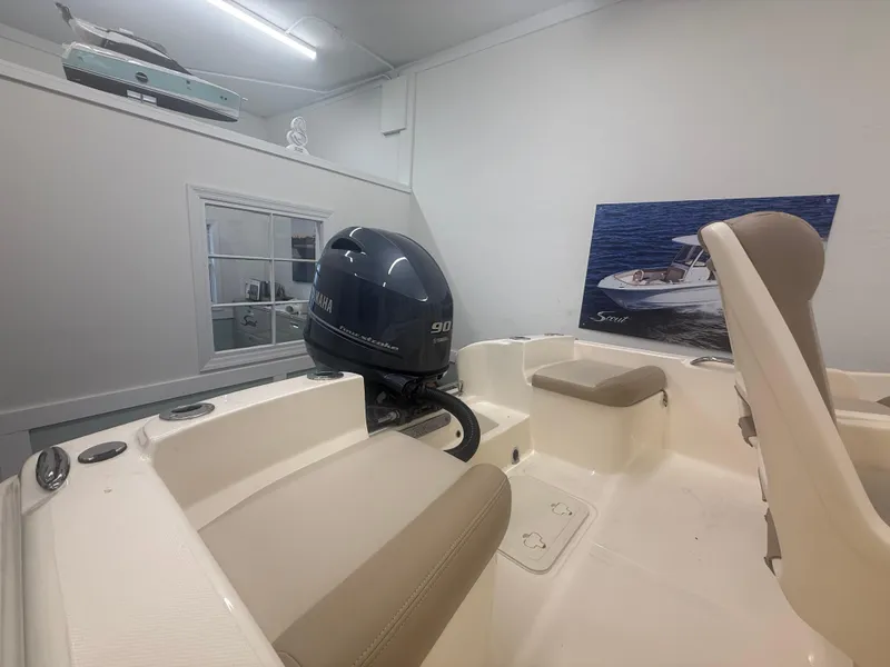 Slide: The Image of 2024 Scout 175 Sportfish boat interior with Yamaha outboard motor in showroom. - 4
