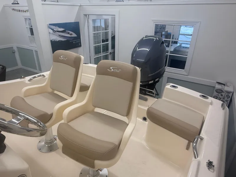 Slide: The Image of 2024 Scout 175 Sportfish boat interior with seating and outboard motor. - 8