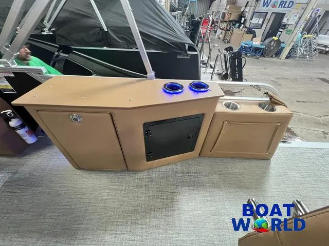 Slide: The Image of 2025 Tahoe LTZ 2385 Cruise Tritoon interior with tan console and cup holders at Boat World. - 17