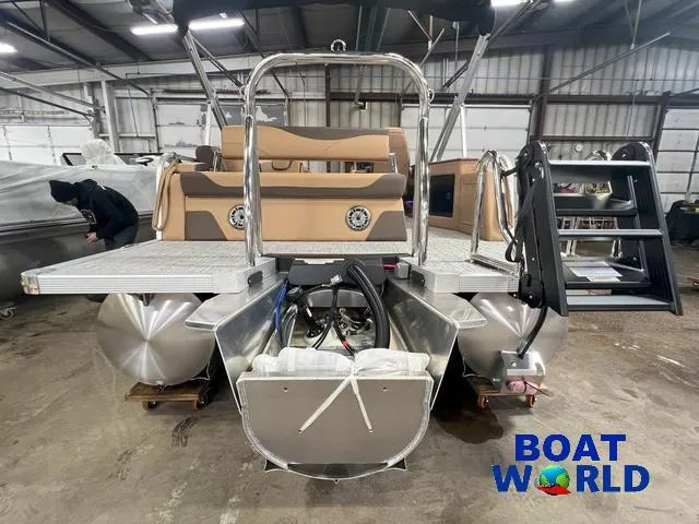 Slide: The Image of 2025 Tahoe LTZ 2385 Cruise Rear Bench Tritoon in warehouse setting. - 27