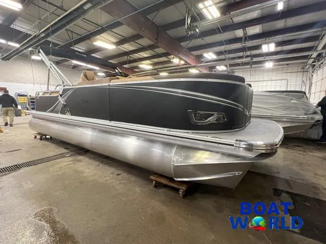 Slide: The Image of 2025 Tahoe LTZ 2385 Cruise Rear Bench Tritoon in showroom, side view. - 30