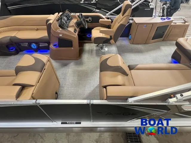 Slide: The Image of 2025 Tahoe LTZ 2385 Cruise Tritoon interior with luxurious seating and modern dashboard. - 4