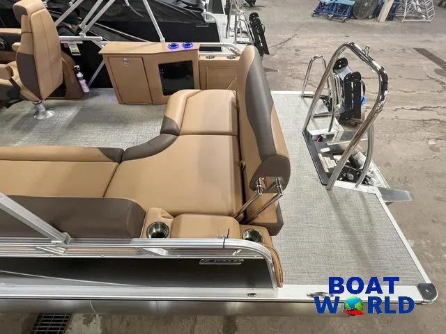 Slide: The Image of 2025 Tahoe LTZ 2385 Cruise Rear Bench Tritoon interior with tan seating, showcased at Boat World. - 5