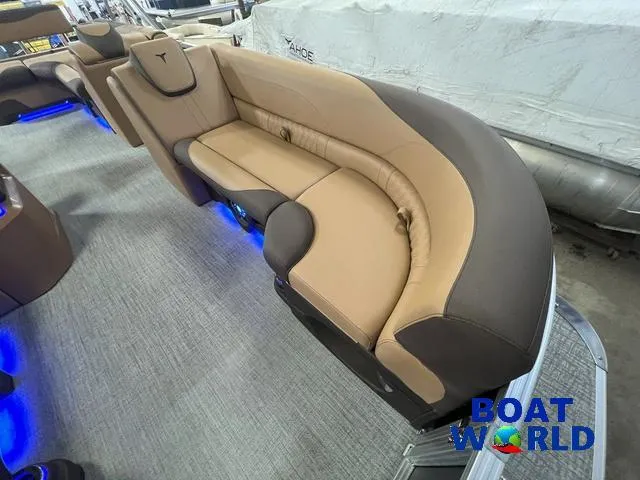 Slide: The Image of 2025 Tahoe LTZ 2385 Cruise Rear Bench Tritoon interior with beige and brown seating. - 8