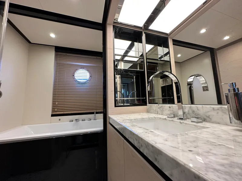Slide: The Image of Luxurious bathroom in 2015 Azimut 80 Flybridge yacht with marble countertop and modern fixtures. - 35