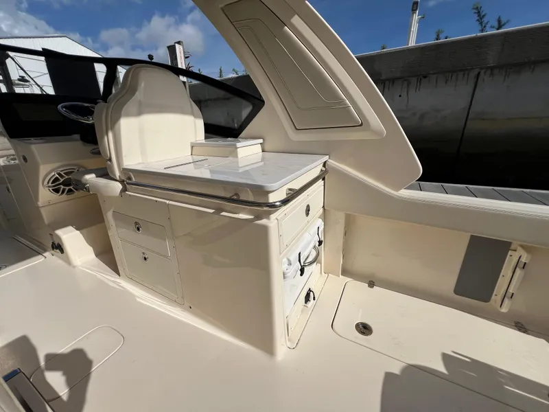 Slide: The Image of 2025 Scout 277 Dorado boat interior with seating and storage compartments. - 19