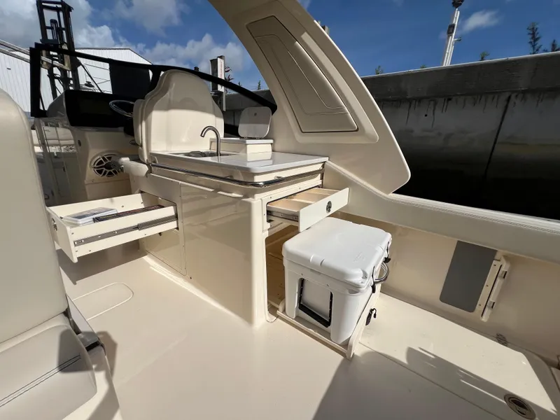 Slide: The Image of Interior of 2025 Scout 277 Dorado boat with storage and sink. - 20