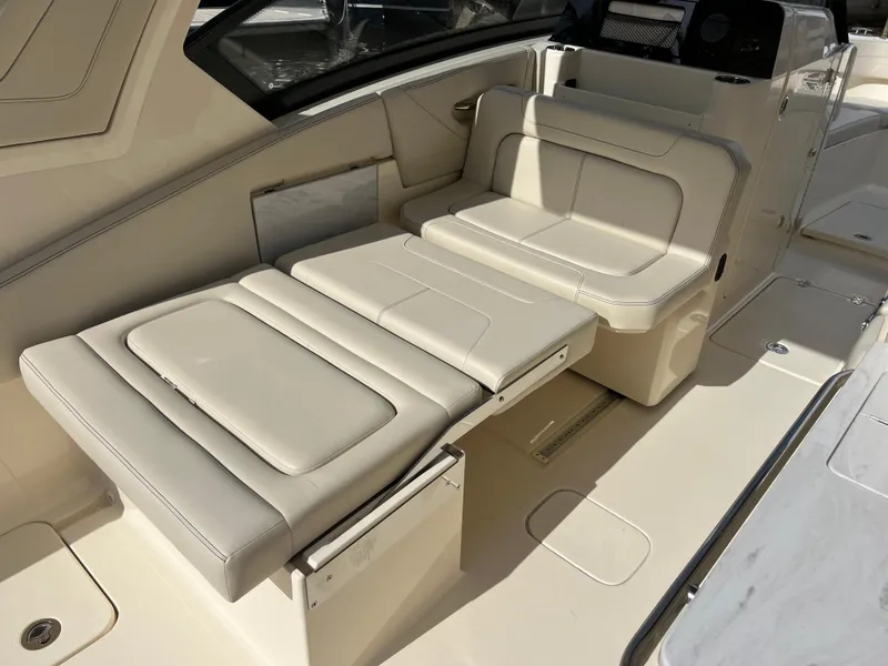 Slide: The Image of 2025 Scout 277 Dorado boat interior with adjustable seating and sleek design. - 23