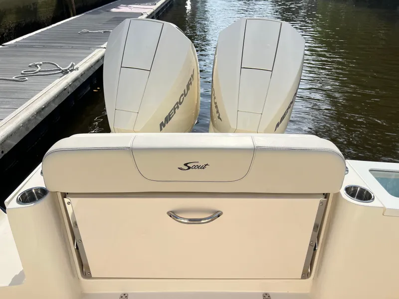 Slide: The Image of 2025 Scout 277 Dorado boat with dual Mercury engines at dock. - 24