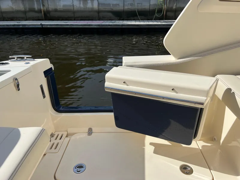 Slide: The Image of 2025 Scout 277 Dorado boat interior with seating and water view. - 27