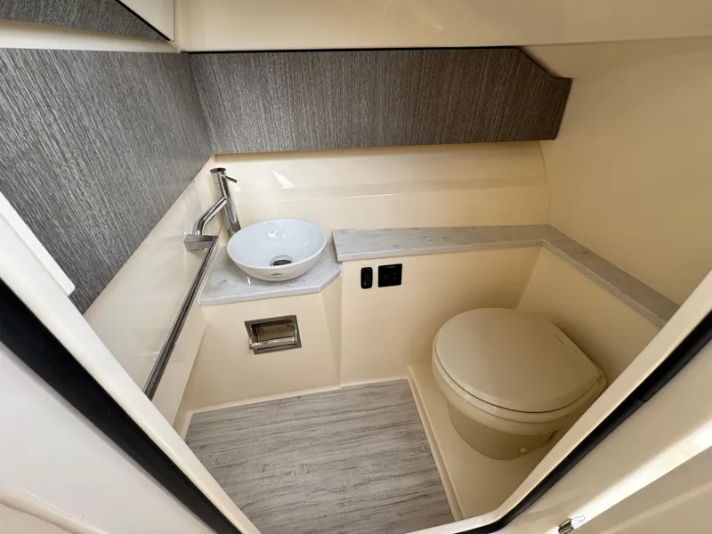 Slide: The Image of 2025 Scout 277 Dorado boat bathroom with modern sink and toilet. - 30