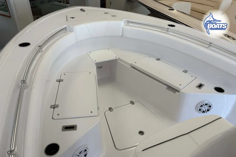 Slide: The Image of 2027 Sportsman Open 212 Center Console boat interior with storage compartments and seating. - 3