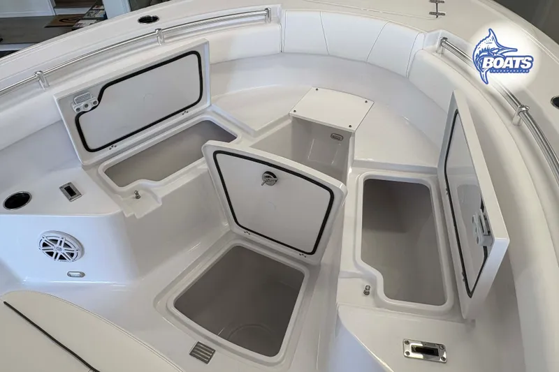 Slide: The Image of 2027 Sportsman Open 212 Center Console boat with open storage compartments and seating area. - 5