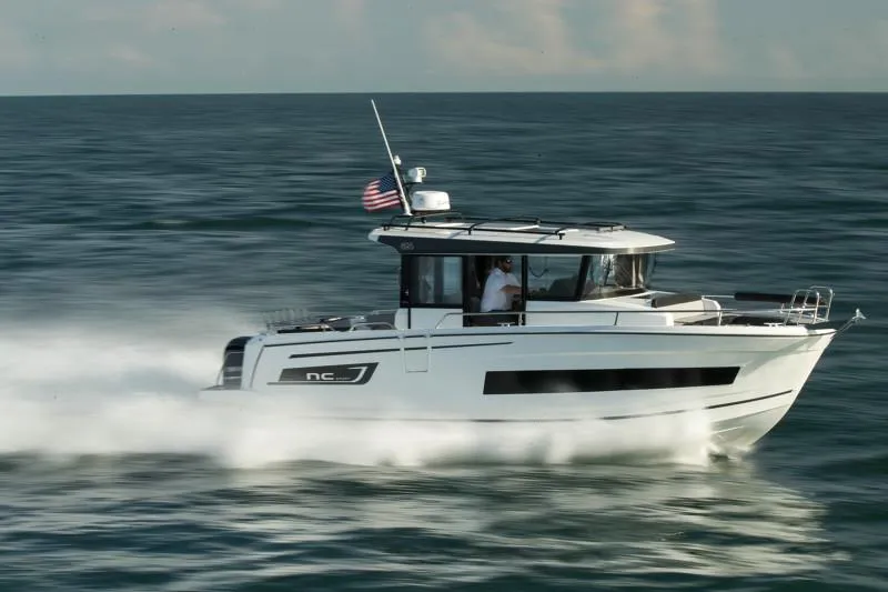 Slide: The Image of 2024 Jeanneau NC Sport 895 cruising swiftly on open water. - 1