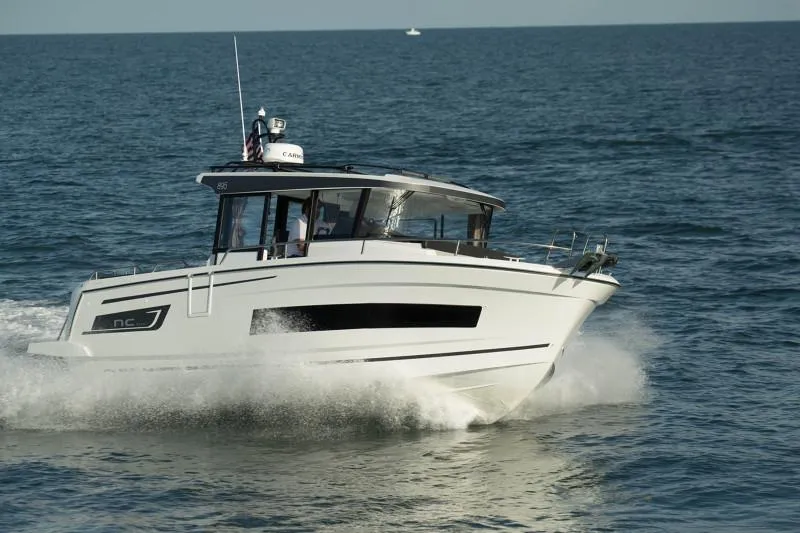 Slide: The Image of 2024 Jeanneau NC Sport 895 cruising on open water. - 5