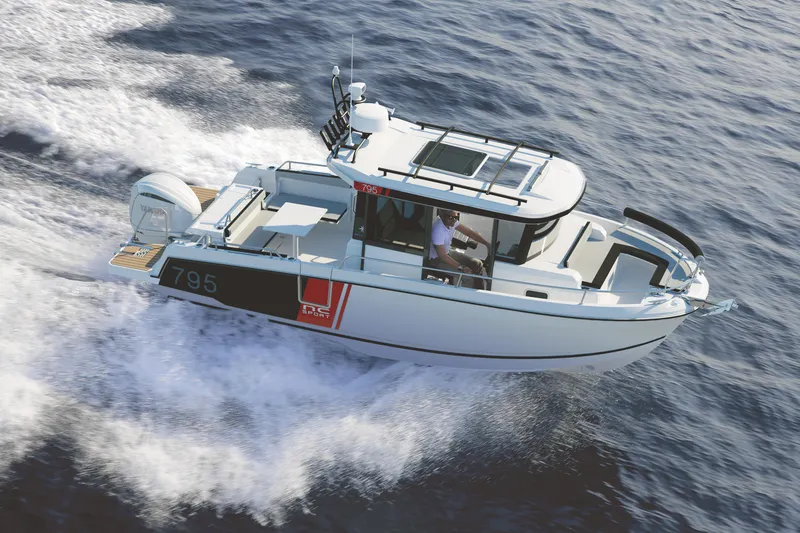 Slide: The Image of 2024 Jeanneau NC 795 Sport boat cruising on open water. - 1