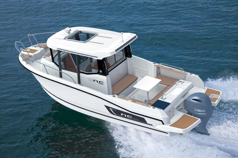 Slide: The Image of 2024 Jeanneau NC 795 Sport boat cruising on open water. - 2