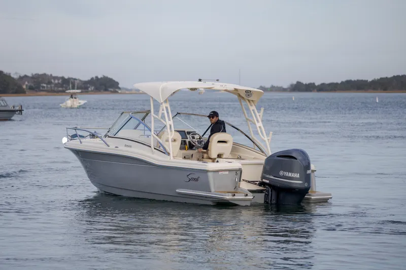 Slide: The Image of 2017 Scout 245 Dorado boat on calm water with Yamaha outboard motor. - 3