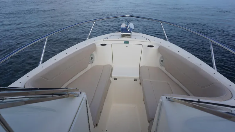 Slide: The Image of 2017 Scout 245 Dorado boat interior with spacious seating on calm water. - 5