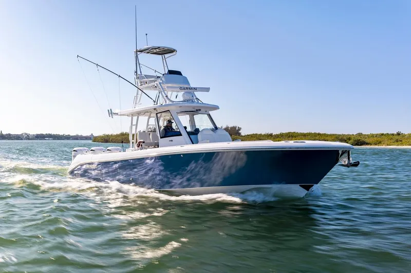 The Image of 2025 Everglades 375 Center Console boat cruising on open water. - 2