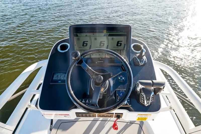 Slide: The Image of 2025 Everglades 375 Center Console helm with advanced navigation displays. - 23