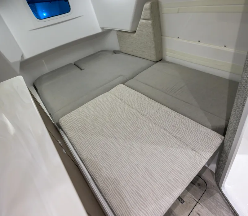 Slide: The Image of 2025 Everglades 375 Center Console cabin interior with comfortable seating and modern design. - 27