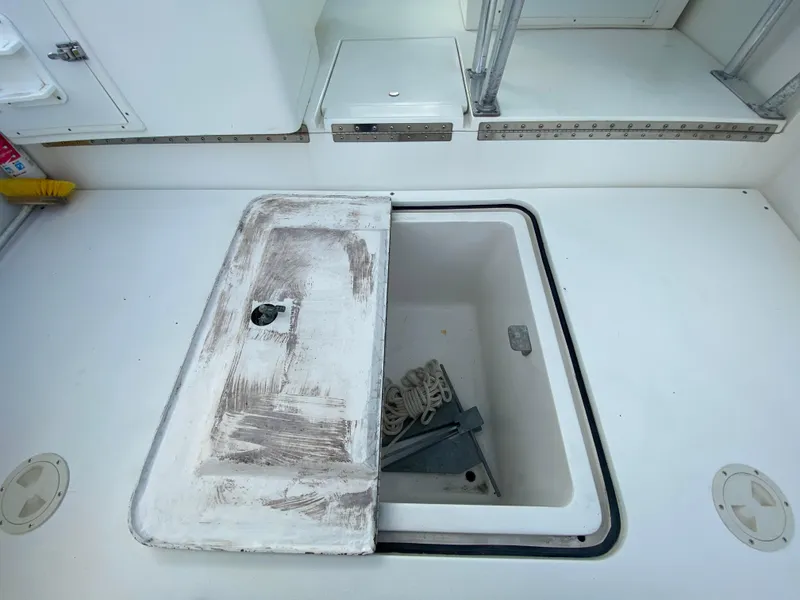 Slide: The Image of Open storage compartment on 1998 Contender 35 Express boat deck. - 10